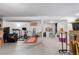 Basement area with storage shelving and exercise equipment on a finished concrete floor at 4350 E 112Th Pl, Thornton, CO 80233