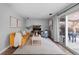 Comfortable living room with neutral tones, stylish furniture, and sliding glass doors to the patio at 4350 E 112Th Pl, Thornton, CO 80233