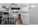 Open-concept living room and kitchen area with hardwood floors and recessed lighting at 4350 E 112Th Pl, Thornton, CO 80233