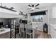 Open-concept living room with a modern black shelving unit and railing at 4350 E 112Th Pl, Thornton, CO 80233