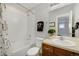 Bright bathroom features a shower and bathtub combo and light beige vanity at 5471 W 97Th Pl # F, Broomfield, CO 80020