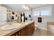 Bright bathroom with double sinks, ample counter space, and modern fixtures at 5471 W 97Th Pl # F, Broomfield, CO 80020