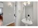 Powder room featuring modern fixtures and a pedestal sink at 5471 W 97Th Pl # F, Broomfield, CO 80020