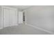 Bedroom features neutral paint, plush carpet, and a large closet for storage at 5471 W 97Th Pl # F, Westminster, CO 80020