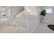 Hallway with neutral paint and plush carpet leads to other parts of the house at 5471 W 97Th Pl # F, Broomfield, CO 80020