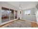 Spacious landing area featuring a sliding glass door, and a staircase at 5471 W 97Th Pl # F, Broomfield, CO 80020