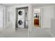 Convenient laundry area with stacked washer and dryer, located near the bathroom at 5471 W 97Th Pl # F, Westminster, CO 80020