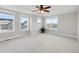 This main bedroom features a ceiling fan and plenty of natural light from the large windows at 5471 W 97Th Pl # F, Broomfield, CO 80020