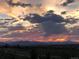 Picturesque mountain view under a dramatic, colorful sunset sky, creating a serene and captivating backdrop at 5471 W 97Th Pl # F, Broomfield, CO 80020