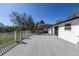 Wide-angle shot of a white back deck showing the wood planks and white railings with views of the backyard at 1266 S Telluride St, Aurora, CO 80017