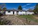 Charming backyard with rock gardens, well-maintained lawn, and a white deck perfect for outdoor relaxation at 1266 S Telluride St, Aurora, CO 80017