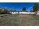 Wide shot of the backyard with a well-manicured lawn and a white fenced deck to relax and entertain at 1266 S Telluride St, Aurora, CO 80017