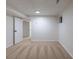 Finished basement bedroom offers neutral carpeting, closet, and a window, creating a comfortable living space at 1266 S Telluride St, Aurora, CO 80017