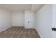 This basement bedroom features neutral carpeting and a single door, providing a cozy and private space at 1266 S Telluride St, Aurora, CO 80017