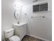 This half-bath features neutral walls, patterned tile flooring, bright vanity, and ample space at 1266 S Telluride St, Aurora, CO 80017