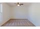 This bedroom features neutral walls, plush carpeting, a ceiling fan, and ample space to relax and personalize at 1266 S Telluride St, Aurora, CO 80017