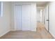 A bedroom featuring a closet with sliding doors, neutral carpeting and white walls at 1266 S Telluride St, Aurora, CO 80017