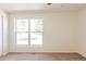 This bedroom offers neutral walls, plush carpeting, large window with bright views, and comfortable ambiance at 1266 S Telluride St, Aurora, CO 80017