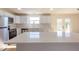Close-up of updated kitchen features white subway tile backsplash and stainless steel appliances at 1266 S Telluride St, Aurora, CO 80017