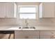 Stylish kitchen showcasing stainless steel appliances and a modern double sink with sleek fixtures at 1266 S Telluride St, Aurora, CO 80017