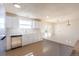 Renovated kitchen with stainless steel appliances, white cabinets, and a view of the backyard at 1266 S Telluride St, Aurora, CO 80017