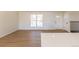 Light-filled living room showcasing beautiful hardwood floors, a front door, and a large front window at 1266 S Telluride St, Aurora, CO 80017