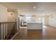 Open-concept living room flows into the updated kitchen with stainless appliances and a large center island at 1266 S Telluride St, Aurora, CO 80017