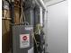 Mechanical room features a newer hot water heater and furnace system for efficient home operation at 1266 S Telluride St, Aurora, CO 80017