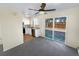 Bright kitchen features white cabinets, stainless steel appliances, and a sliding glass door at 1391 Vance St, Lakewood, CO 80214