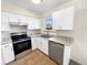 A kitchen featuring stainless steel appliances, granite countertops, and updated cabinetry at 1391 Vance St, Lakewood, CO 80214