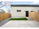 Backyard featuring a concrete patio area, grassy area, and fencing at 2520 S Cherokee St, Denver, CO 80223