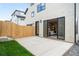 The backyard has a concrete patio and grassy area with access to the home's living room at 2520 S Cherokee St, Denver, CO 80223