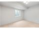 Neutral basement space with a window and carpet at 2520 S Cherokee St, Denver, CO 80223