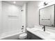 Bathroom with subway tile, modern fixtures, and a gray vanity at 2520 S Cherokee St, Denver, CO 80223