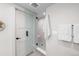 Modern bathroom with a glass-enclosed shower, sleek fixtures, and neutral color palette at 2520 S Cherokee St, Denver, CO 80223