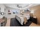 Well-lit bedroom with wood slat accent wall and a comfortable bed and nightstands at 2520 S Cherokee St, Denver, CO 80223