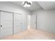 This bedroom has sliding closet doors and white trim around all doors and baseboards at 2520 S Cherokee St, Denver, CO 80223