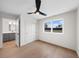 Bright bedroom features a ceiling fan, closet, and view of a window with lots of natural light at 2520 S Cherokee St, Denver, CO 80223