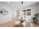 Elegant dining area with modern lighting, glass table, and light wood flooring at 2520 S Cherokee St, Denver, CO 80223