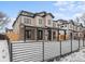 Beautiful home featuring a metal fence, covered porch, and clean modern lines at 2520 S Cherokee St, Denver, CO 80223