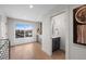 A hallway leads to a wet bar and powder room at 2520 S Cherokee St, Denver, CO 80223