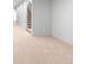 Hallway features neutral carpet with access to a staircase and multiple other rooms at 2520 S Cherokee St, Denver, CO 80223