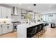State-of-the-art kitchen with an island, stainless steel appliances, and a gas range at 2520 S Cherokee St, Denver, CO 80223