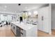 Well-appointed kitchen with a large quartz island, stainless steel appliances, and an open design at 2520 S Cherokee St, Denver, CO 80223