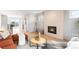 Modern living room with a striking fireplace, wood floors and lots of natural light at 2520 S Cherokee St, Denver, CO 80223