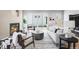 Bright living room features a modern fireplace, stylish furniture, and seamless indoor-outdoor flow at 2520 S Cherokee St, Denver, CO 80223
