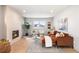 Comfortable living room with fireplace, stylish decor, and large windows at 2520 S Cherokee St, Denver, CO 80223