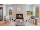 Cozy living room with a modern fireplace, neutral tones, and comfortable seating at 2520 S Cherokee St, Denver, CO 80223