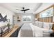Relaxing main bedroom showcases modern ceiling fan and wood accent wall at 2520 S Cherokee St, Denver, CO 80223