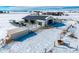 Aerial view of a horse ranch with barn and stables in snowy landscape at 7295 Sunset Ave, Elizabeth, CO 80107